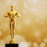 Por que o Oscar é dourado? Descubra a história, o simbolismo e as curiosidades por trás do prêmio mais famoso do cinema mundial.